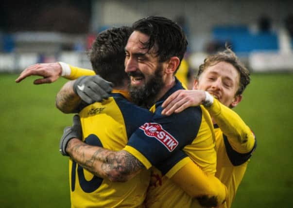 Jonathan Greening, centre, is congratulated after netting Tadcaster Albion's winner against Bamber Bridge. Picture: Matthew Appleby