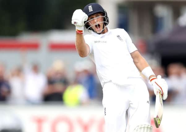 England's Joe Root celebrates his double century against Pakistan. (Picture: Martin Rickett/PA Wire)