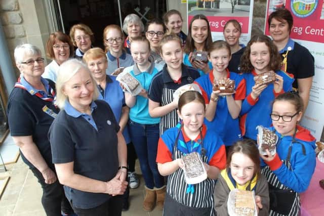 Girl Guide Fundraising. County Commissioner Sue Mackay with guides at St. Peter's Church. (1702181AM2).