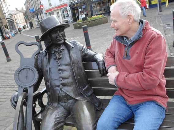 Blind Jack Committee's Bernard Higgins with a statue of Blind Jack in Knaresborough's Market Place. (1702211AM7)
