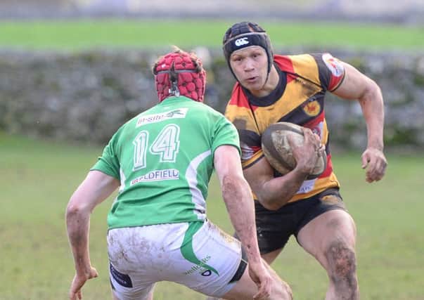 Keane Naylor looks for a way past the Wharfedale defence during Harrogate RUFC's derby day defeat. Picture: Richard Bown