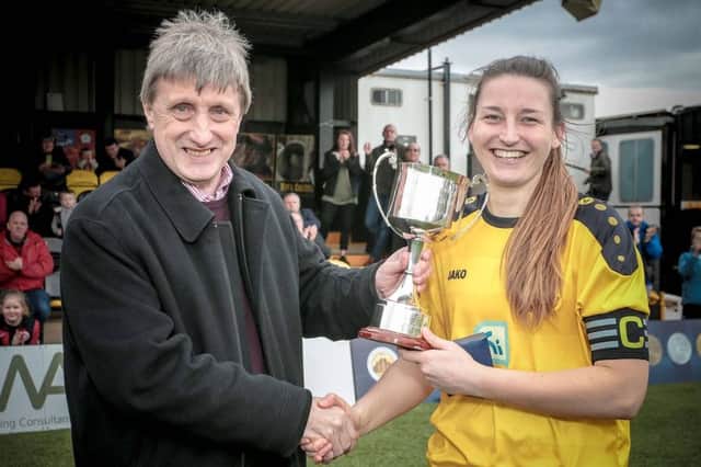 Harrogate Town Ladies captain Lindsey Whitton receives the North Riding Womens Football League trophy. Pictures: Caught Light Photography