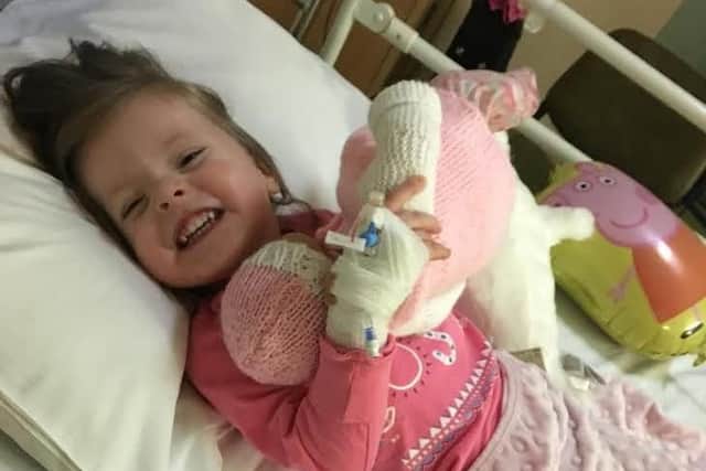 Macey, always smiling, on day three of her stay in hospital. Picture: Robyn Clarke