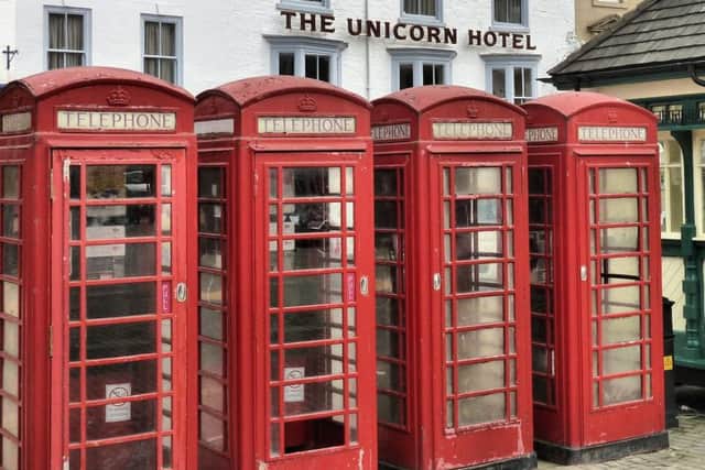 Telephone boxes, designed by Giles Gilbert Scott, on Ripon Market Square. (Copyright - David Winpenny)