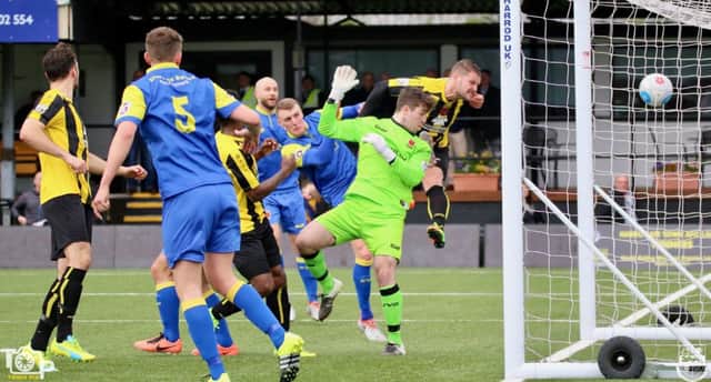 Simon Ainge powers home a header to put Harrogate Town 2-0 up against Chorley. Picture: Town Pix