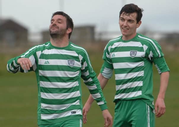 Knaresborough Celtic's Tom Durrance, left, celebrates after finding the back of the Pannal Sports net. Picture: Adrian Murray