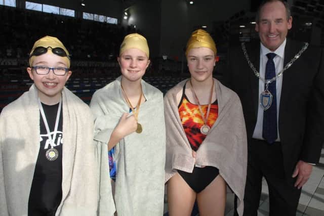 NADV 1703192AM3 Harrogate & District Swimming Gala.  Medal winners Macey Rathmell, Ariane Regan and Rachael Hattan with Coun. Stan Lumley (Cabinet member for Culture and Sport.(1703192AM3)