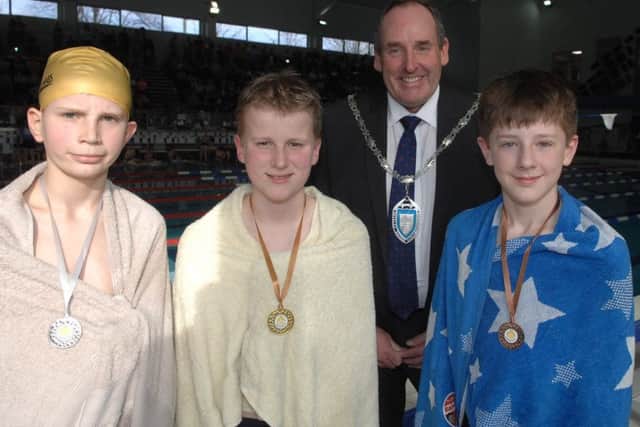 NADV 1703192AM2 Harrogate & District Swimming Gala. Medal winners Martin Ayre, Ruairi Harrison and Logan Atyeo with Coun. Stan Lumley (Cabinet member for Culture and Sport.(1703192AM2)