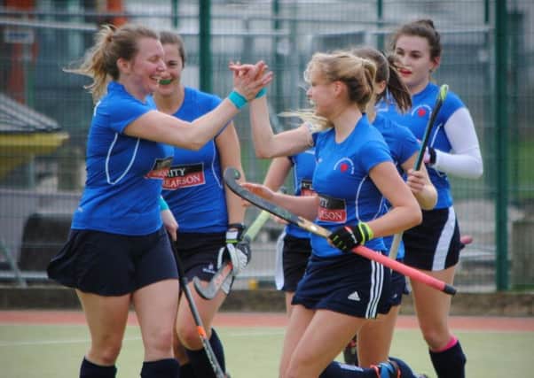 Harrogate Ladies celebrate after finding the net during their derby victory over Ben Rhydding