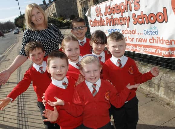 Headteacher Mary Young and youngsters Charlotte Watson, Jack Norman, Miles McGhee, Lydia Jackson, Freddie Wright, Fraser Gower and Kate Wilcock