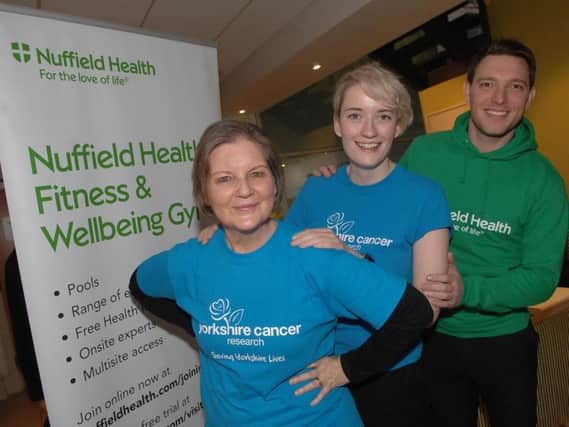 Swimmer Karen McMillan-Jones with Yorkshire Cancer Reserch's Louise Robinson and Nuffield Health Fitness & Wellbeing Gym in Harrogate deputy general manager Tom Woollard.