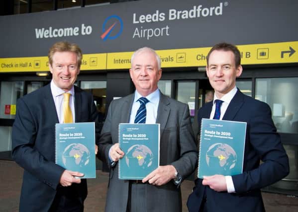 Aviation development director Tony Hallwood, chief executive John Parkin and head of planning development Charles Johnson with the Route to 2030 plan for Leeds Bradford Airport. Picture: Richard Walker/www.imagenorth.net