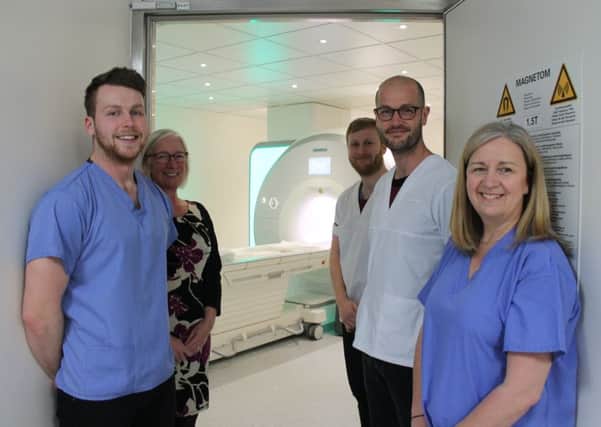Members of the radiology team pictured with the new scanner (from left) Andrew Harris, Fiona Harker, Michael Tye, Andrew Turner and Carole Moore.