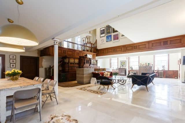 The ground floor living space with marble floor from Lapicida.