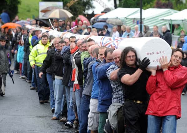 Volunteers carry the Barwick-in-Elmet Maypole to the Cross for the Maypole to be raised. 30 May 2011.
Picture Bruce Rollinson