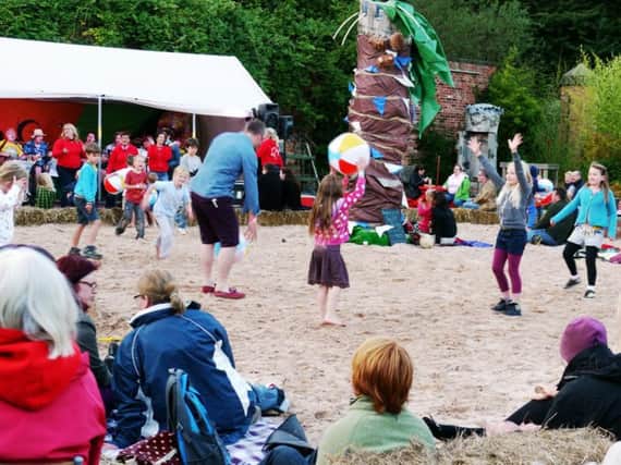 Families enjoying last year's Henshaws Urban Beach.