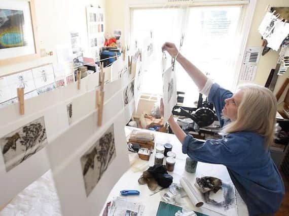 Harrogate artist Laney Birkhead at work in her studio.
