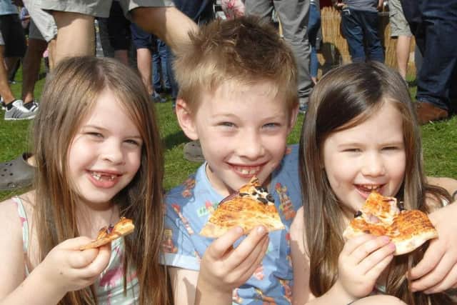 Enjoying the weekend's StrEAT Food Festival in the Valley Gardens are youngsters from The Kitchings - Isabella, Rhys and Sienna. (1708263AM4)