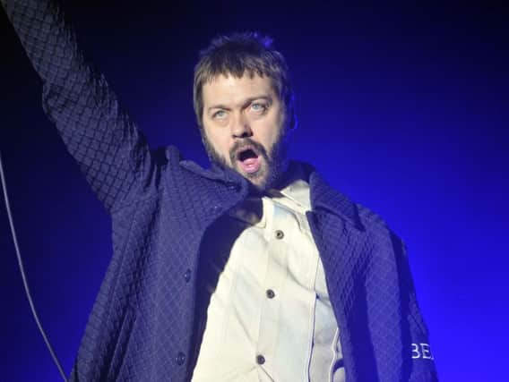 Saturday night headliners Kasabians lead singer Tom Meighan who emerged from his sick bed to play Leeds Festival.