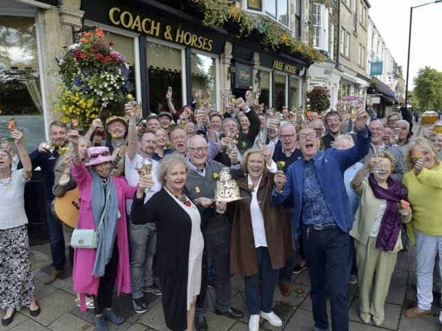 John Nelson owner of the Coach and Horses, West Park, Harrogate with Martin House staff and customers
