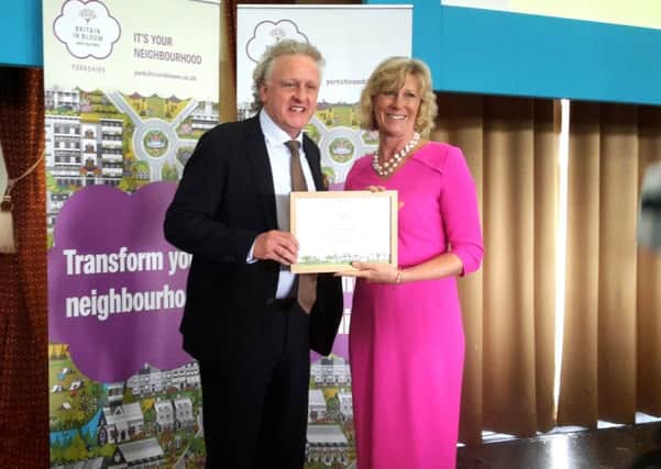 Keith Tordoff accepting the Yorkshire In Bloom award from Lady Emma Ingilby
