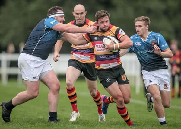 Harrogate RUFC's Noel Minikin looks for a way through the Hull defence. Picture: Caught Light Photography
