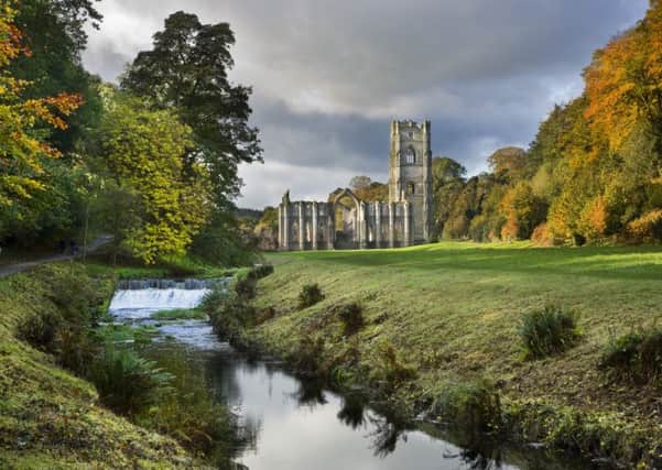 A view along the River Skell in autumn towards Fountains Abbey, North Yorkshire, a Cistercian community of monks from the twelfth century until the Dissolution in 1539. It is the largest monastic ruin in the country, and a World Heritage Site.