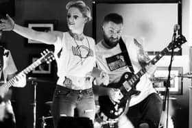 The Omega Era are joined on stage at Monteys in Harrogate by a member of Harrogate Roller Derby team.