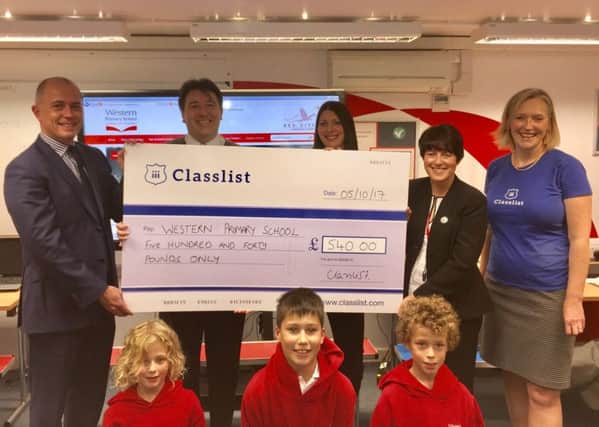 Classlist co-founder Clare Wright, together with Harrogate business leaders Ken Gibson of Alexander Gibson Estate Agents and Andrew Meehan of Harrogate Family Law present the Â£540 cheque to Western Primary School Headteacher Cheryl Smith.