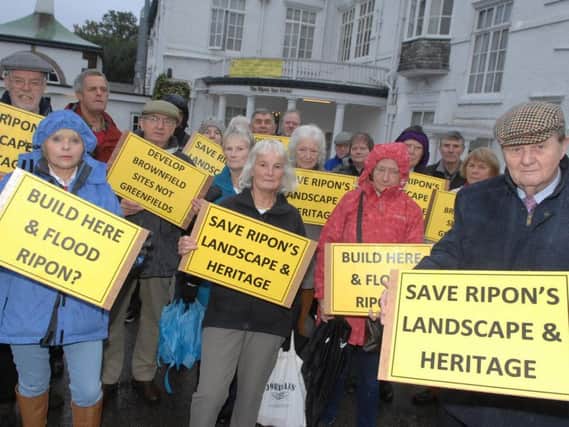 Protesters outside the Ripon Spa Hotel at the start of the inquiry.