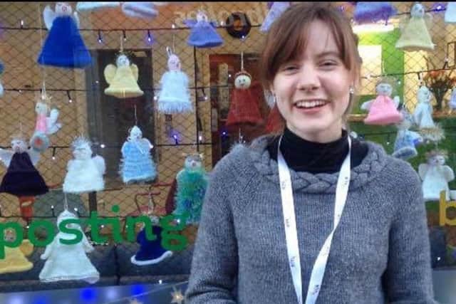 Ella Green from the Harrogate Hub with the eye-catching window display of knitted angels.