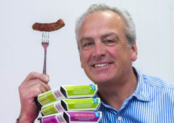 Heck co-founder Andrew Keeble with some of his fast-selling sausages. (S)