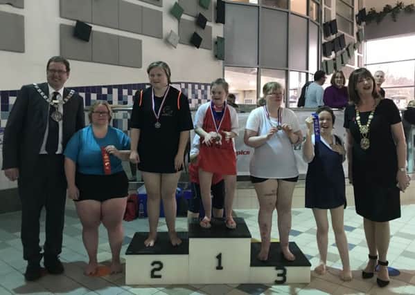 One of the many medal presentations at the Special Olympics Swimming Gala.