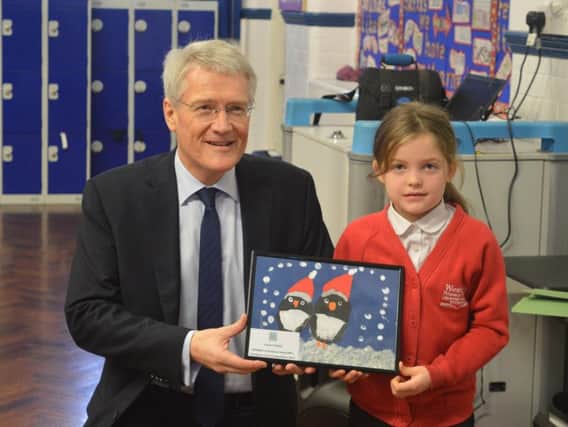 MP Andrew Jones awarded Louisa with a framed copy of her card