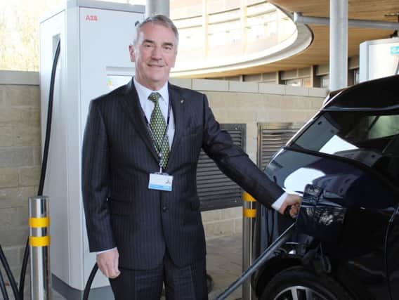 Coun Phil Ireland, Harrogate Borough Councils cabinet member for sustainable transport, tries out one of the three new rapid electric car chargers for public use at the councils civic centre.