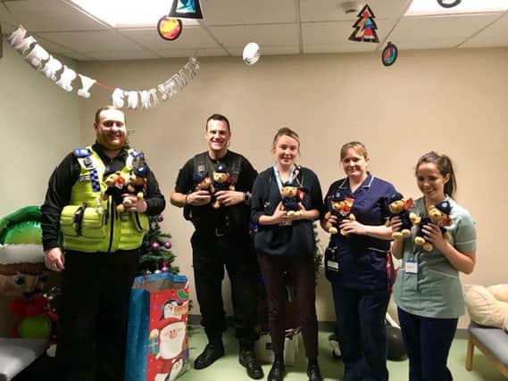 PCSO Matt Murphy and Insp. Paul Cording with staff from the childrens ward at Harrogate. (Credit: P. Cording)