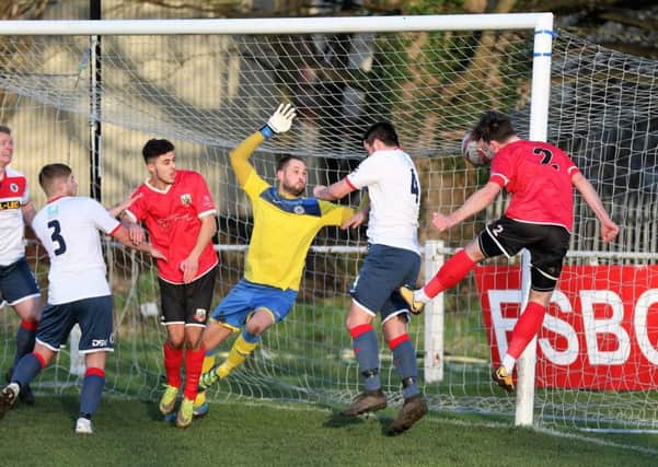 Dan Thirkell heads home Knaresborough Town's second goal in their demolition of Grimsby Borough. Picture: Craig Dinsdale