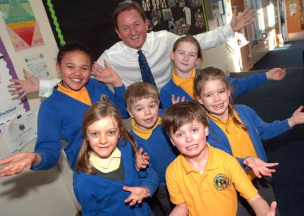 NAWN 1801161AM1Deputy Head Mark Knight and pupils at Bardsey Primary School celebrate their good Ofsted report. (1801161AM1)