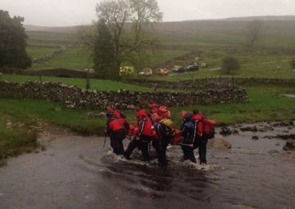 The fell rescue team in action during the Beckermonds call out. Photo by Iain Geldard.