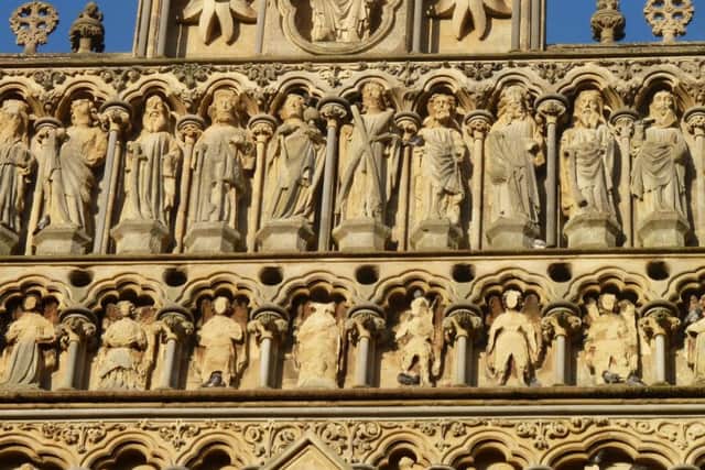 Detail of the west front of Wells Cathedral; the row of circular holes allowed the sound from the gallery behind to emerge. (Copyright - David Winpenny)
