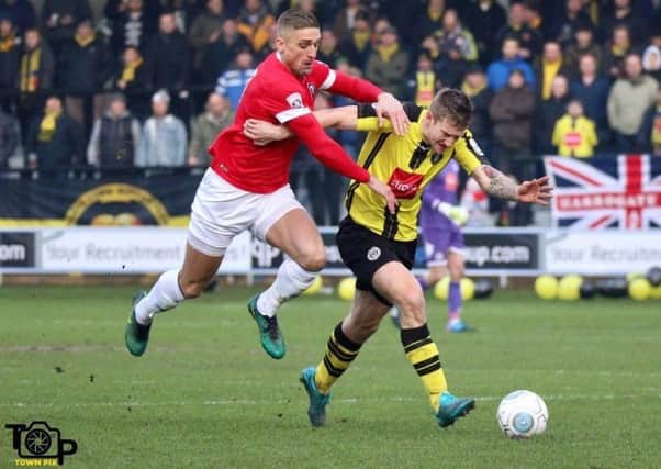 Louie Swain in action during Harrogate Town's loss at Salford City. Picture: Town Pix
