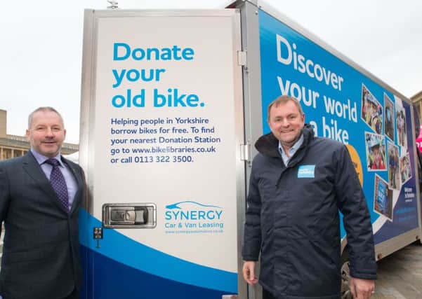 Sir Gary Verity (right) with Paul Parkinson (Synergy) next to a bike library van sponsored by Synergy. (S)