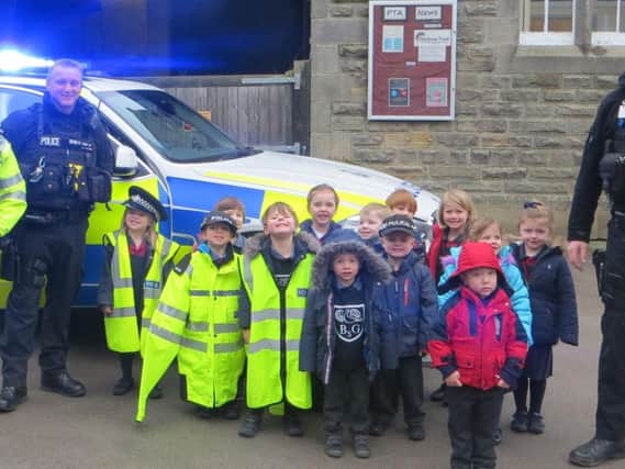 Officers from RAF Menwith Hill with pre-reception pupils at the school