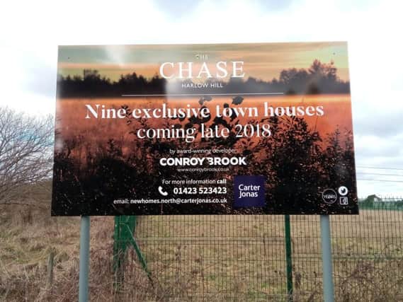 The sign for new town houses on Harlow Hill in Harrogate.