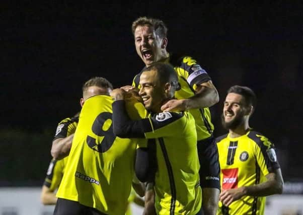 Harrogate Town players celebrate one of their four first-half strikes during Tuesday's thrilling success over Alfreton. Picture: Town Pix