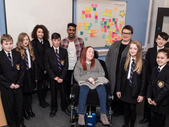 Jubel Ahmed, Lauren Doherty and Clare Flynn with pupils from Harrogate High School