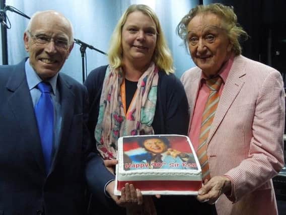 Mike Hine and Mary Stalker present Sir Ken Dodd with a special birthday cake.