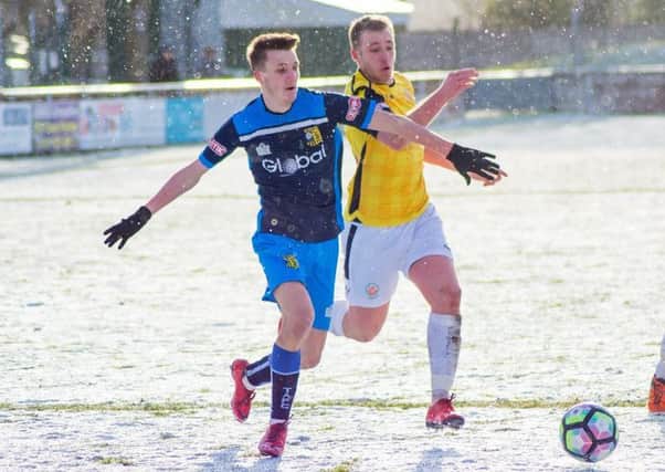 Tadcaster Albion 's Casey Stewart in action in the snow at Trafford. Picture: Matthew Apppleby