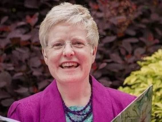 Fostering a friendly and open discussion - with cake! Death Cafe organiser Cate Quinn.