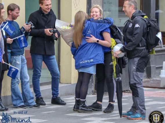 Chloe Bellerby arriving at Mind's national headquarters as she finishes her epic walk for charity. Picture: Matt Kirkham.